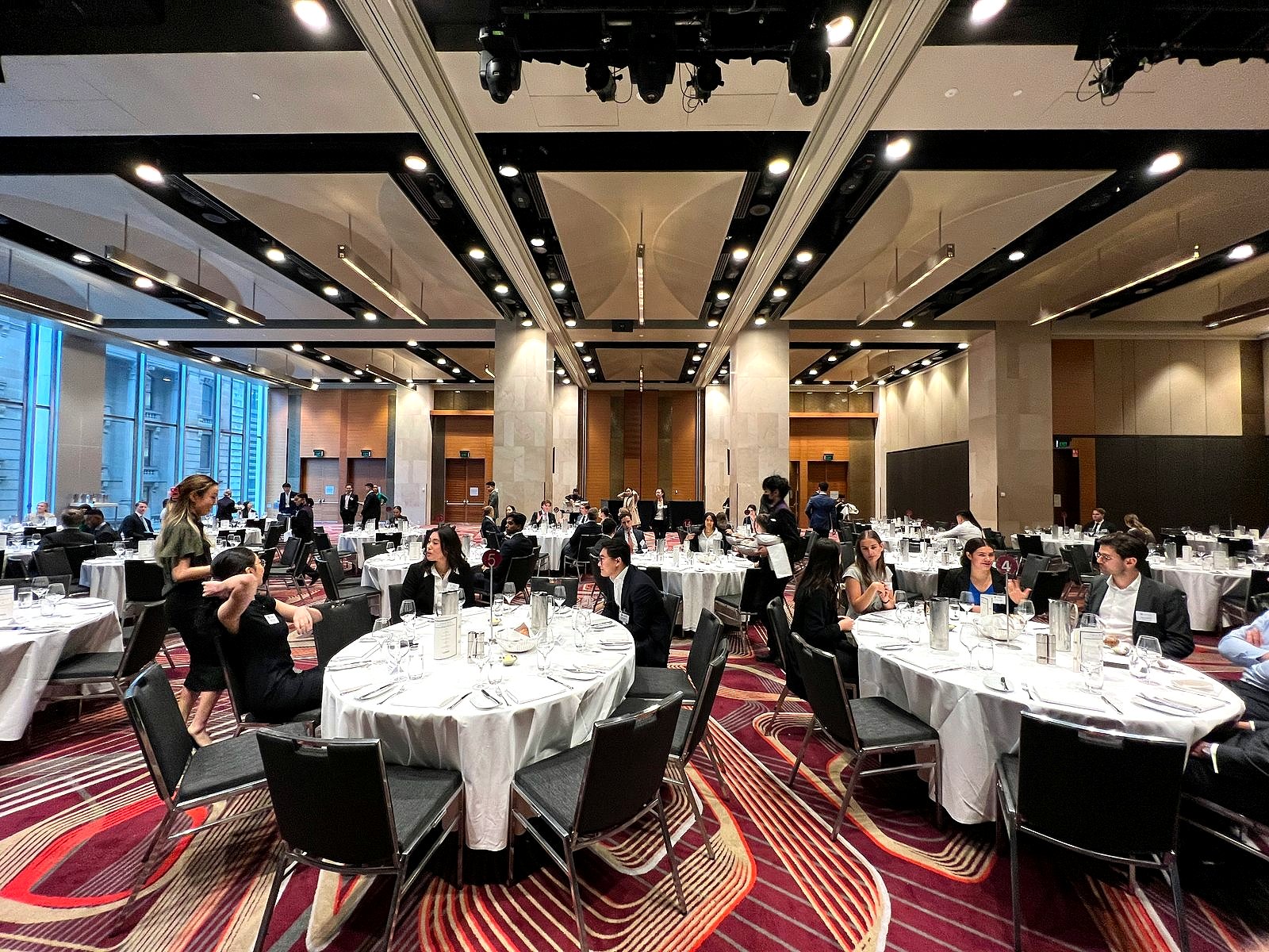 An elegant corporate banquet hall set up for a formal event